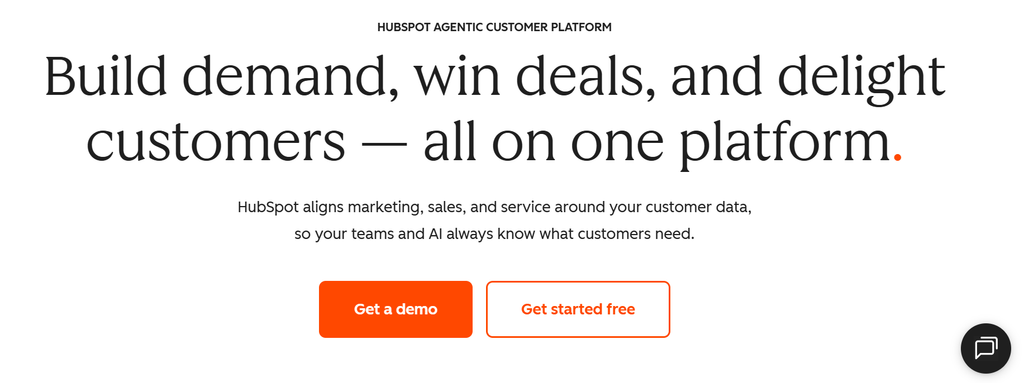 HubSpot homepage showing "Build demand, win deals, and delight customers" hero section 